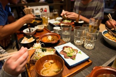 Cropped image of man eating food