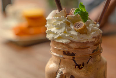 Close-up of ice cream in jar on table