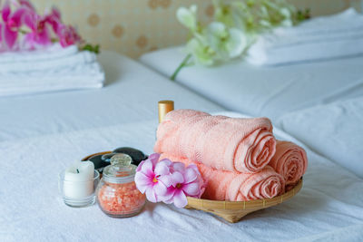 Close-up of pink rose on table at home