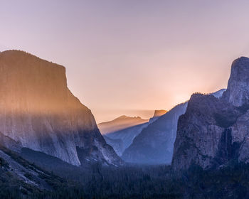 Scenic view of mountains against sky during sunset