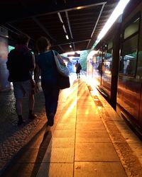 People walking on railroad track