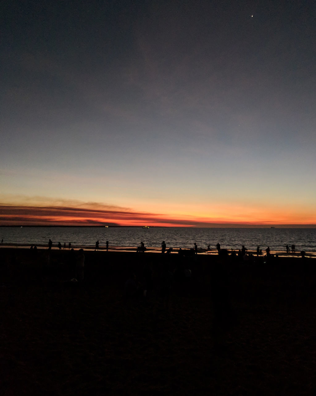 SCENIC VIEW OF BEACH DURING SUNSET