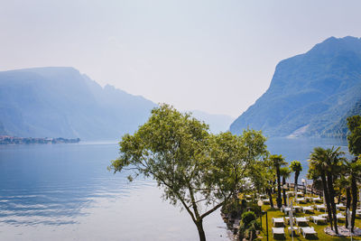 Scenic view of sea and mountains against sky