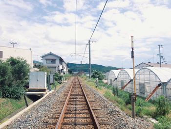 Railroad tracks against sky