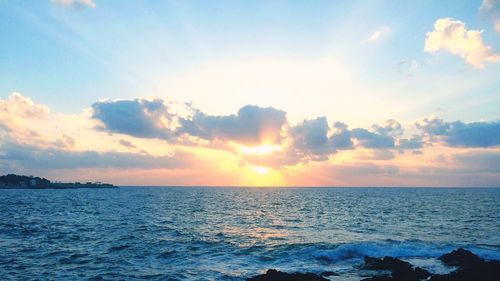 Scenic view of sea against sky during sunset