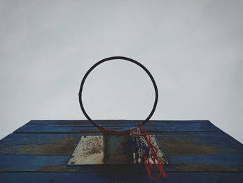 Low angle view of basketball hoop against sky