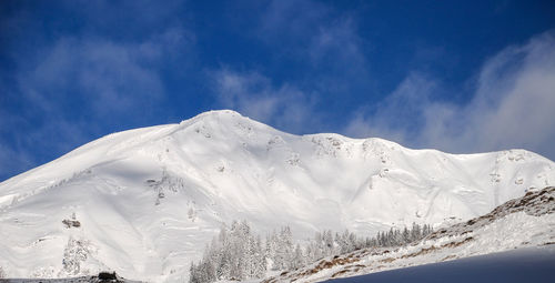 Snow covered mountain against sky