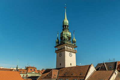 Low angle view of building against clear blue sky