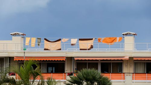 Clothes drying on terrace against clear sky