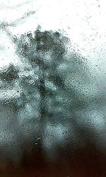 Close-up of water drops on glass