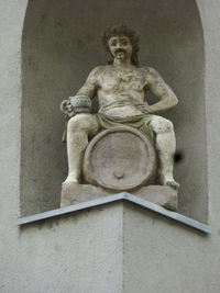 Low angle view of statue against black background