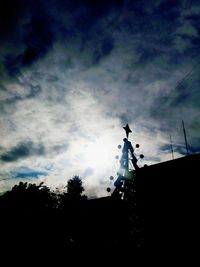 Low angle view of silhouette trees against sky during sunset