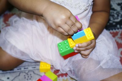 Close-up of girl with toy toys