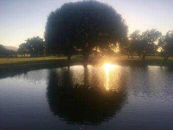 Scenic view of lake at sunset