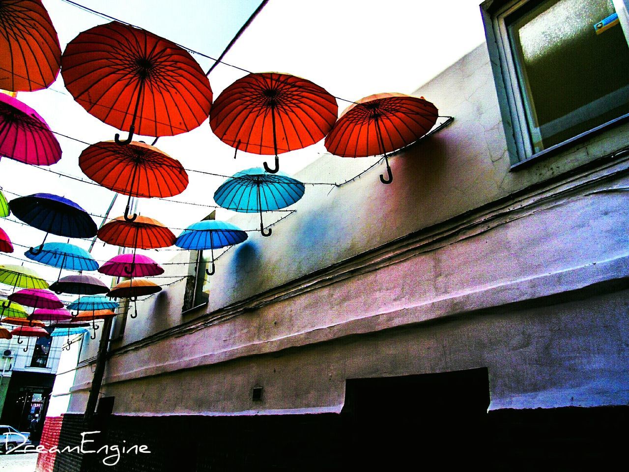 low angle view, multi colored, no people, architecture, day, built structure, hanging, outdoors, close-up