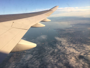 Cropped image of airplane over sea