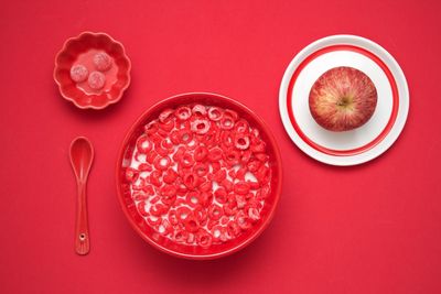 High angle view of drink on table against red background