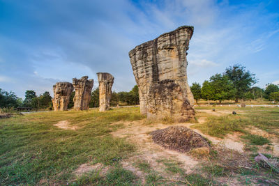 Stone structure on field against sky