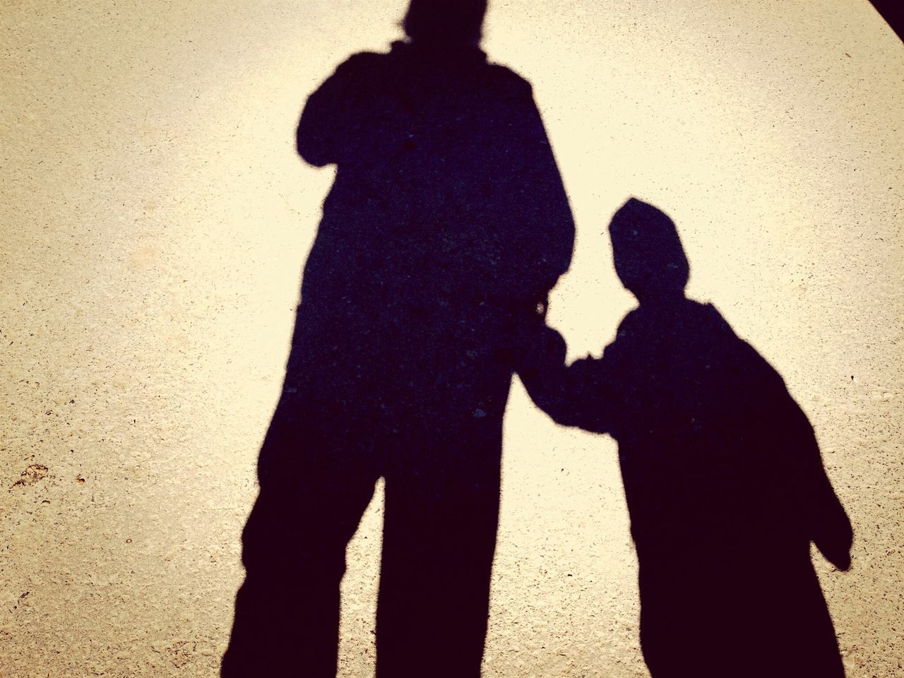 shadow, silhouette, focus on shadow, lifestyles, leisure activity, standing, three quarter length, men, sunlight, high angle view, togetherness, bonding, love, outline, wall - building feature, night, gesturing