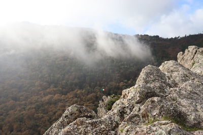 Scenic view of  mountain  with italian flag in fog