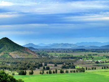 Scenic view of mountains against cloudy sky