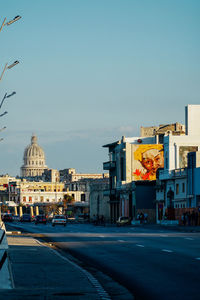 Buildings in city against clear sky