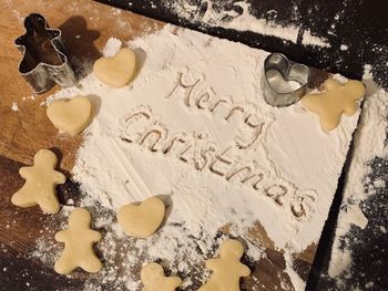 High angle view of cookies on wooden floor