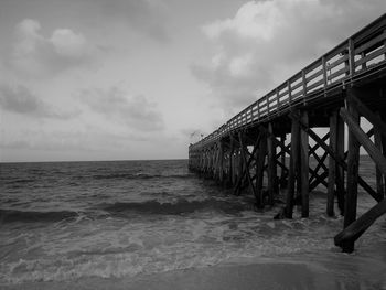 Pier over sea against sky