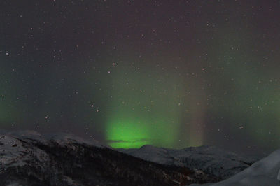 Scenic view of lake against sky at night