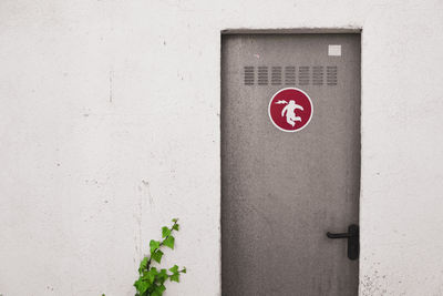 Close-up of sign on wall