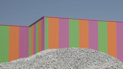 Close-up of multi colored cargo container against clear sky