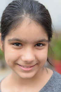 Close-up portrait of smiling woman