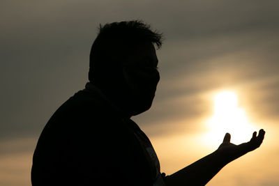 Portrait of silhouette man against sky during sunset