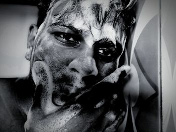 Close-up portrait of young man at home