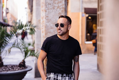 Portrait of young man standing outdoors