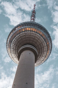 Low angle view of building against cloudy sky