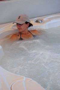 Woman taking bath in hot tub