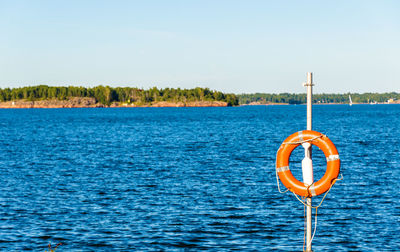 Scenic view of blue sea against clear sky