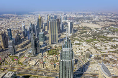 High angle view of modern buildings in city against sky