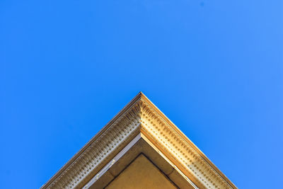 Low angle view of building against clear blue sky