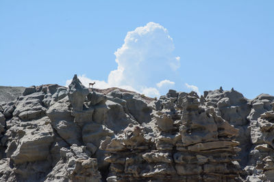 Low angle view of stack against sky