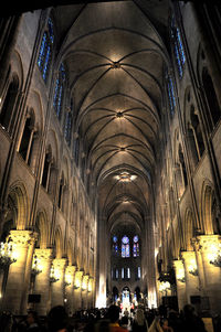 People in illuminated cathedral