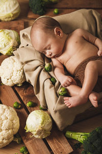 Midsection of woman holding stuffed toy on table