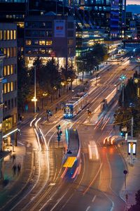 High angle view of light trails on city street at night