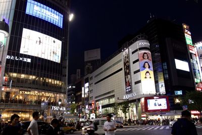 Illuminated city street at night