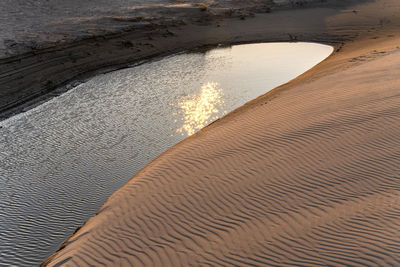 High angle view of sand dunes at beach