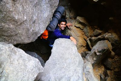 Man sitting on rock