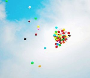 Multi colored balloons against blue background