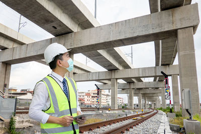 Full length of man working at construction site.