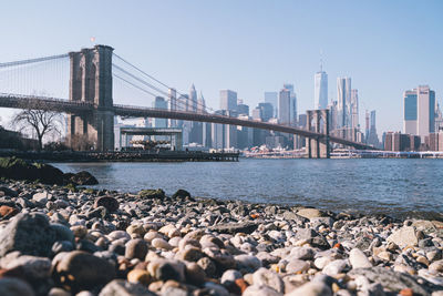 View of suspension bridge with city in background